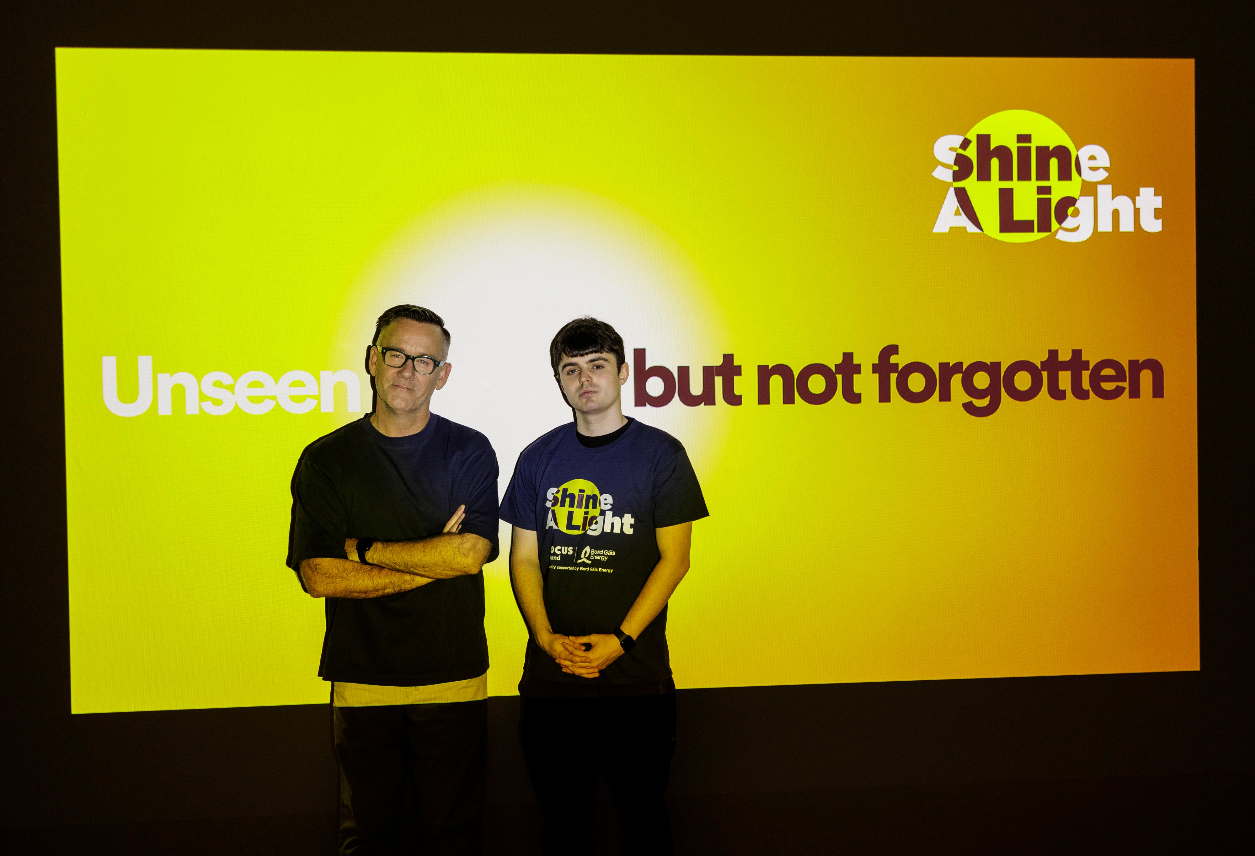 Brendan Courtney in front of Shine a Light Night billboard